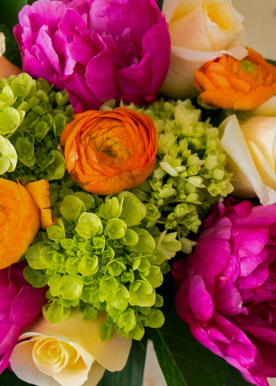 Bouquet of colorful flowers on a wooden surface