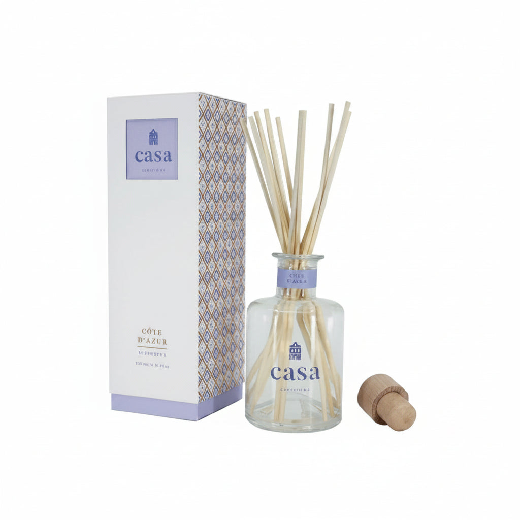 Casa diffuser bottle with reeds and packaging on a white background