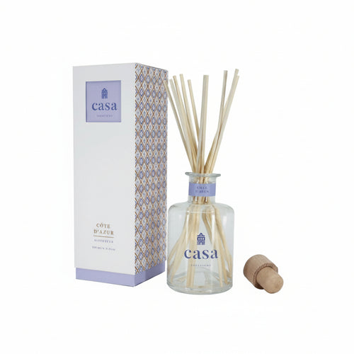 Casa diffuser bottle with reeds and packaging on a white background